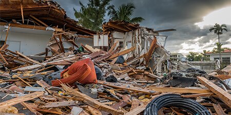 The remains of a destroyed house after a disaster
