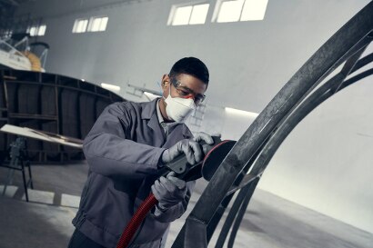 Worker sanding with 3M Xtract system
