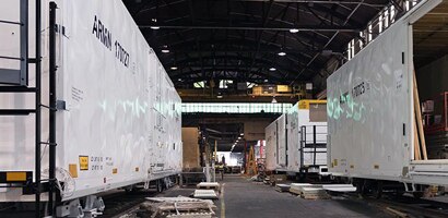 Man working outside on truck wearing PPE
