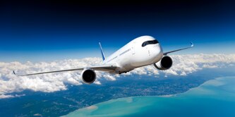 Airplane flying through sky