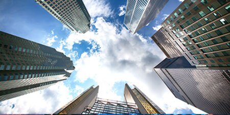 view of skyscrapers above from ground

