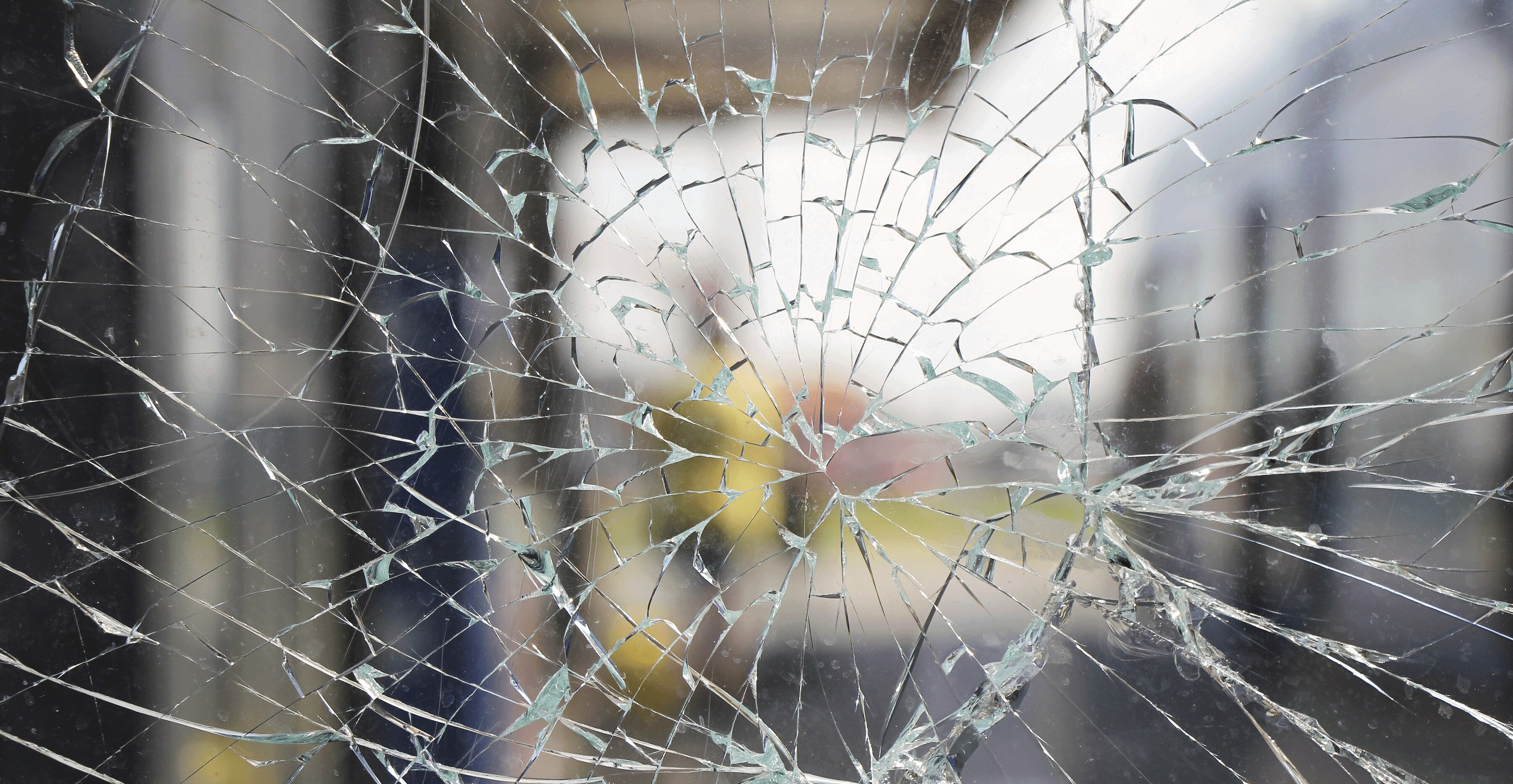 view of a building through shattered glass
