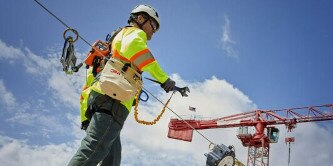 Worker on wearing harness and lifeline.
