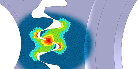 Image of finite element modeling showing stress points on interacting gearwheels
