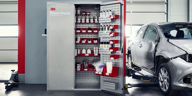 The 3M™ RepairStack™ cabinet is shown partially opened next to a damaged vehicle.
