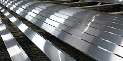 Strips of aluminum ready for metal adhesive
