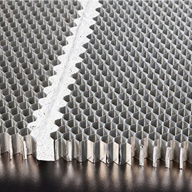 Core splice film joining mismatched honeycomb structures