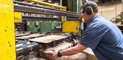 Man and woman at table discussing PPE industry solutions
