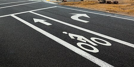 Road with turn signal and bike lane markings
