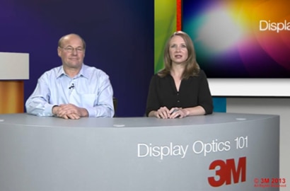An image of a man and woman behind the desk.