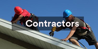 two workers on a rooftop
