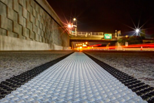 a close up view of 380AW applied on a highway