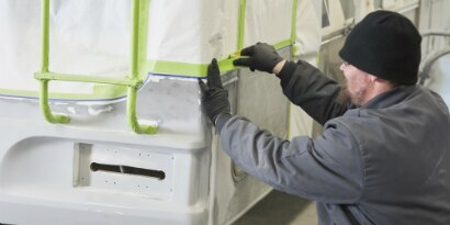 worker applying masking tape
