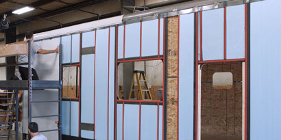 Image of the side panel of a trailer with VHB tape applied
