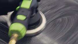 Sander being used on large surface of a car