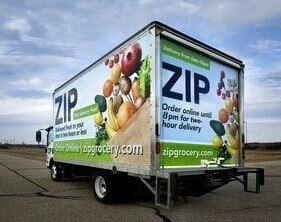 ZIP delivery truck with large 3M graphic wrap on the trailer.
