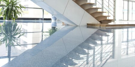Reflection of a commercial space off of a stone floor
