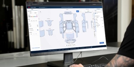 A monitor with automotive film plotting software on the screen.
