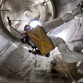 Man in a confined space wearing 3M Respiratory protection