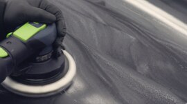 Sander being used on large surface of a car