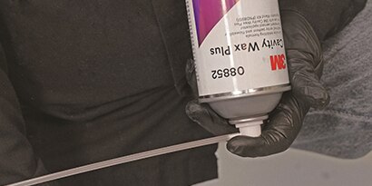 spraying cavity wax into closed panel
