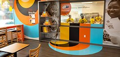 Bakery retail interior featuring bright printed wall graphics created with graphic film