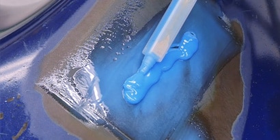 Applying blue adhesive with static mixing nozzle
