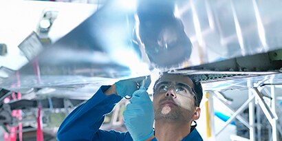 engineers working to structure an aircraft
