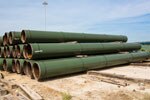 Stacks of coated pipe on site