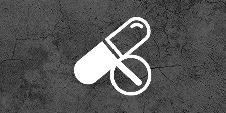 Pill icon on dark concrete texture
