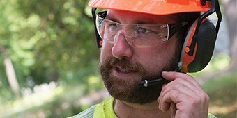 Worker wearing 3M Hearing Protection earmuffs
