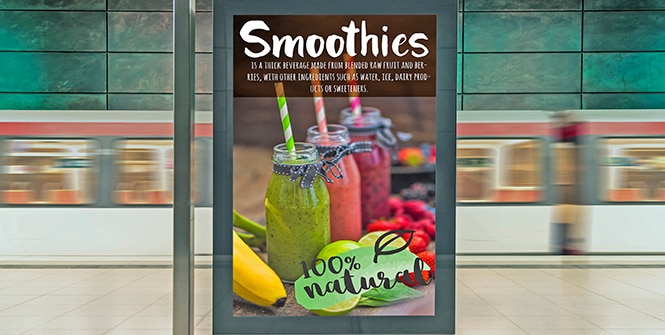 A large digital display sign with a smoothie advertisement on it.
