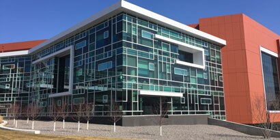 Image of the exterior of a new building with Glass Panels
