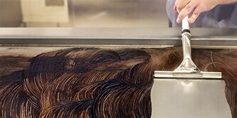 Scotch-Brite™ Griddle Cleaning System being used to clean a griddle
