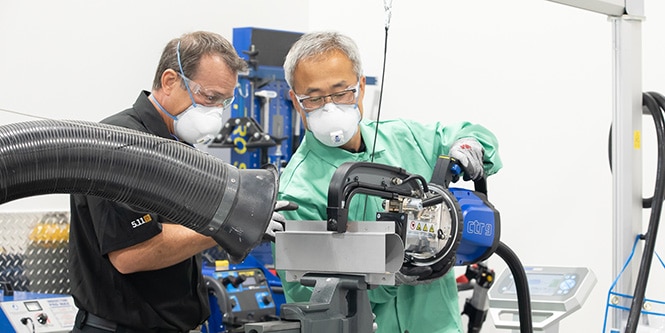 man using tool, while instructor directs how to use elearning
