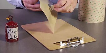 Video still of the demonstrator preparing to bond a metal part to a polypropylene slab
