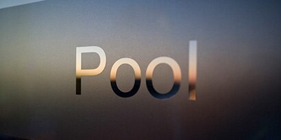 Glass finish with the word “Pool” on it.
