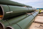 Stacks of coated pipe