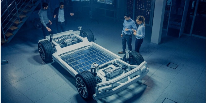 Four engineers designing new vehicle
