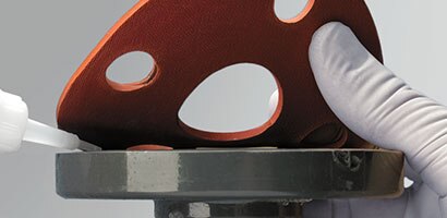 Gasket adhesive for industrial applications
